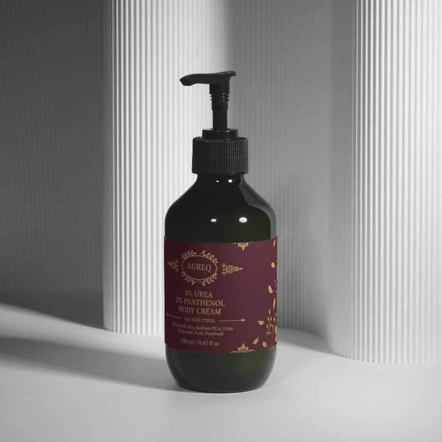 5% Urea + 2% Panthenol Body Cream in a dark bottle with pump, designed for intense moisture and hydration.