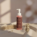 Radiant Glow Facial Wash - Refresh & Revitalize Your Skin bottle on a neutral background with dried flowers.