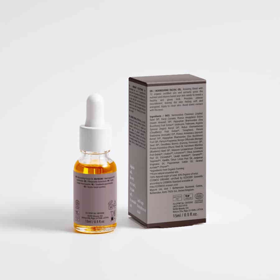 Nourishing Facial Oil in a dropper bottle with a box, showcasing organic botanical ingredients.